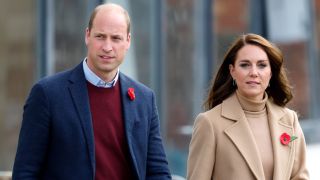 Prince William and Kate Middleton walking hand in hand outside the event.