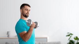 Man exercising with dumbbells