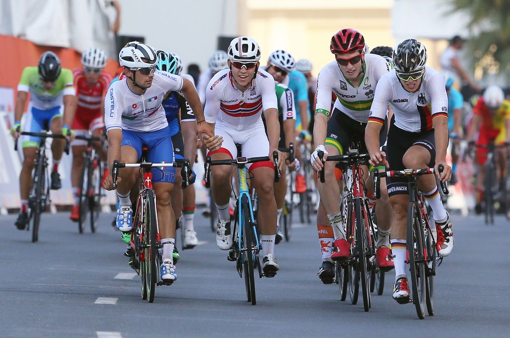 Jason Lowndes, far right in red helmet, after crossing the line in sixth place in the U23 Worlds road race