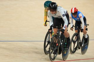 US' Jennifer Valente, Australia's Georgia Baker and Canada's Maggie Coles-Lyster compete in the women's track cycling omnium elimination race of the Paris 2024 Olympic Games at the Saint-Quentin-en-Yvelines National Velodrome in Montigny-le-Bretonneux, south-west of Paris, on August 11, 2024. (Photo by Emmanuel DUNAND / AFP)