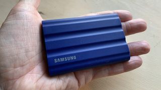 Samsung T7 Shield held in a hand