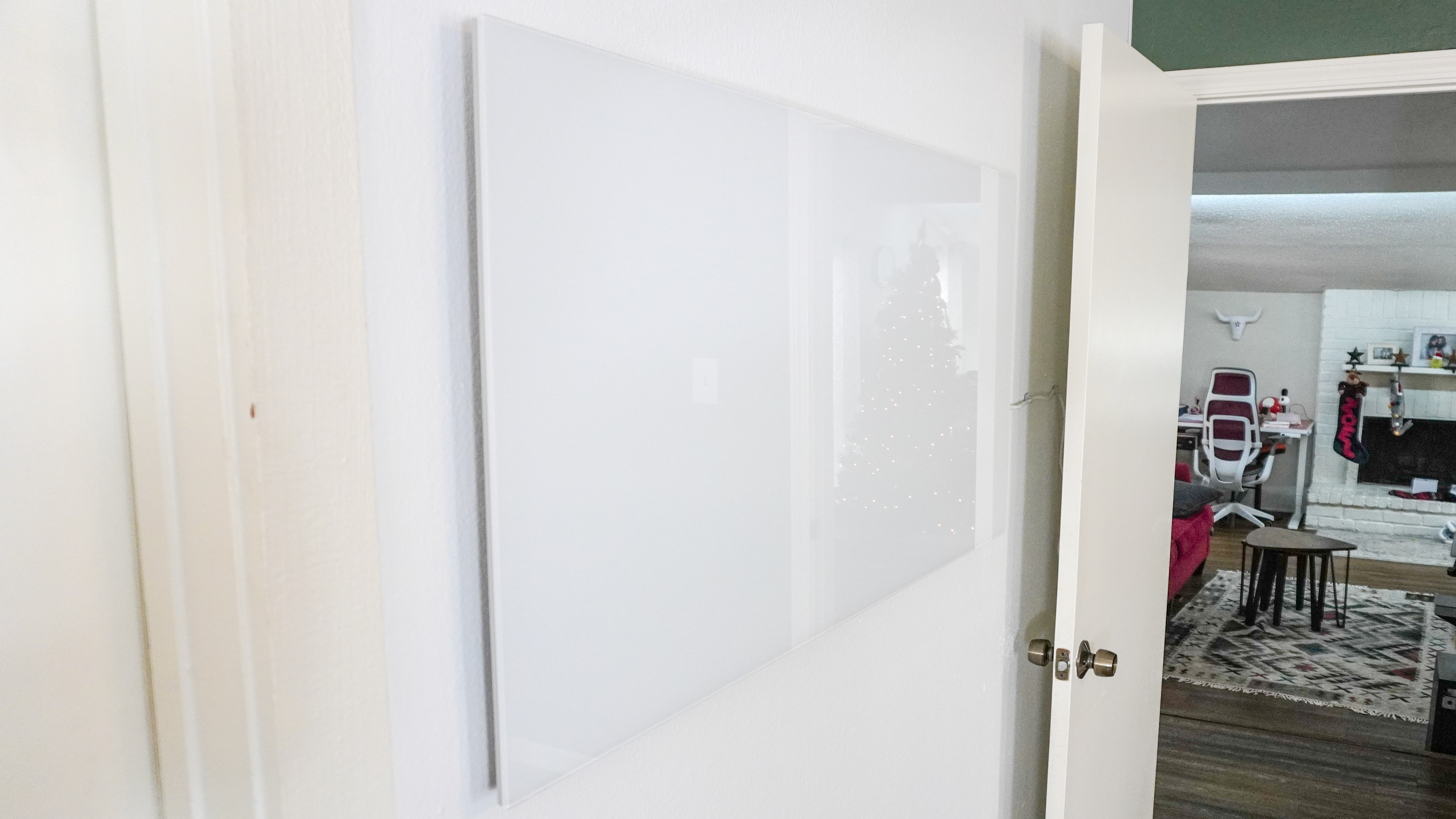 A side view of the Boldr Kelvin infrared heater installed on a wall