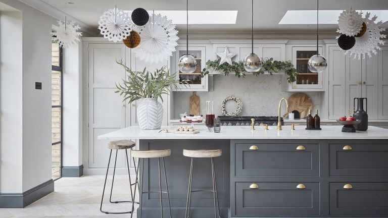 grey kitchen with white paper Christmas decorations 