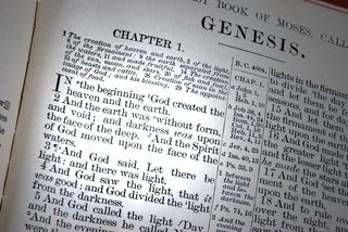 The Bible open to the Book of Genesis.