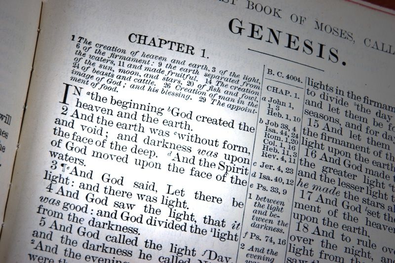 The Bible open to the Book of Genesis.