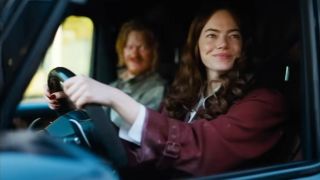 Emma Stone and Jesse Plemons in a car together in Bugonia. 