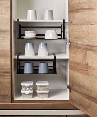 Under shelf baskets hanging in cupboard