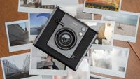 Instax Wide photo prints stacked on top of each other with an Instax Wide Evo camera in the centre