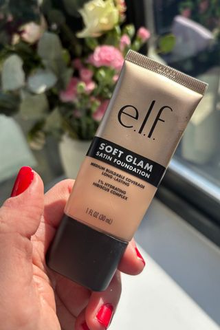 a hand holding e.l.f soft glam foundation