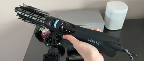 The Revamp Progloss Airstyle 6-in-1Air Styler DR-1250 being held ready to use