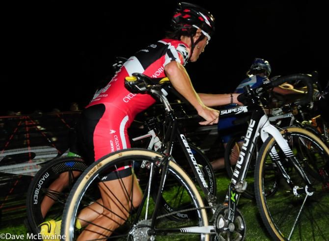 Lyne Bessette (Cyclocrossworld.com) running with her bike on lap three