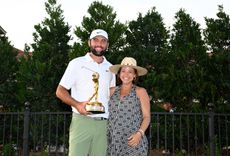 Scottie Scheffler and his wife Meredith celebrate the 2024 Players Championship win