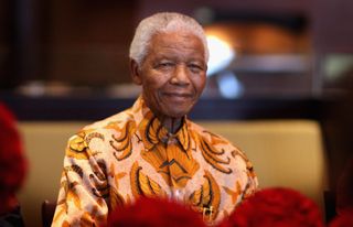Nelson Mandela smiles during a lunch to Benefit the Mandela Children's Foundation