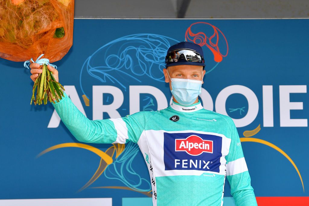 ARDOOIE BELGIUM SEPTEMBER 02 Tim Merlier of Belgium and Team AlpecinFenix celebrates winning the Turquoise points jersey on the podium ceremony after the 17th Benelux Tour 2021 Stage 4 a 1661km stage from Aalter to Ardooie BeneluxTour on September 02 2021 in Ardooie Belgium Photo by Luc ClaessenGetty Images