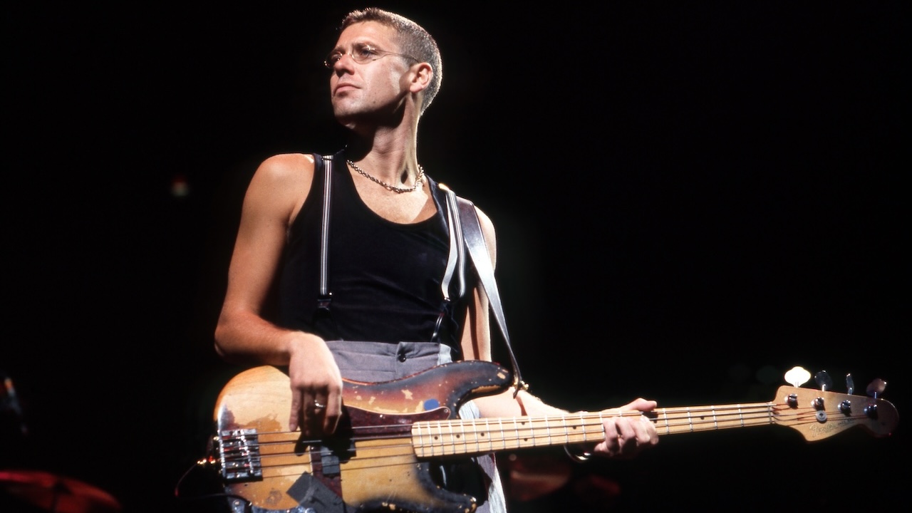 English-born Irish musician who is the bass guitarist for U2, Adam Clayton performs during "The Joshua Tree Tour" on April 30, 1987, at the Pontiac Silverdome in Pontiac, Michigan