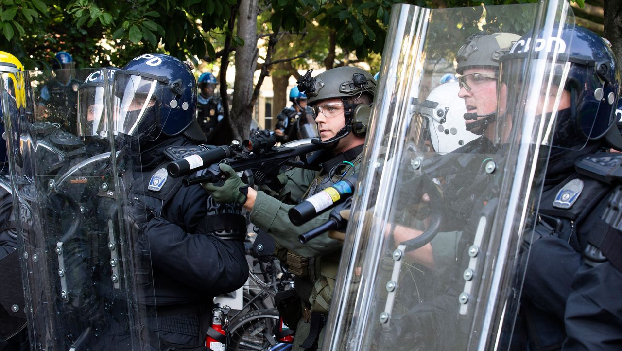 Riot police outside the White House in Washington DC