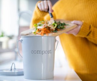 home composting unit being filled with scraps