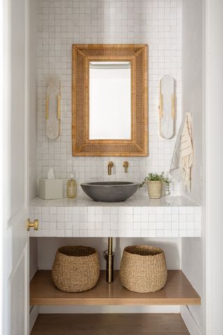Small bathroom with stone vessel sink by Lindye Galloway