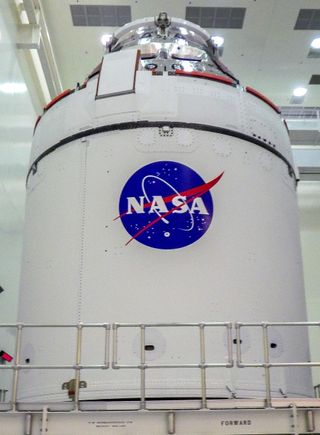 A close-up view of the Artemis I Orion spacecraft with NASA’s famous “meatball” insignia is affixed to the spacecraft adapter jettison fairings, which protect the European built service module, inside the Multi-Payload Processing Facility at Kennedy Space Center on Jan. 20, 2021. 