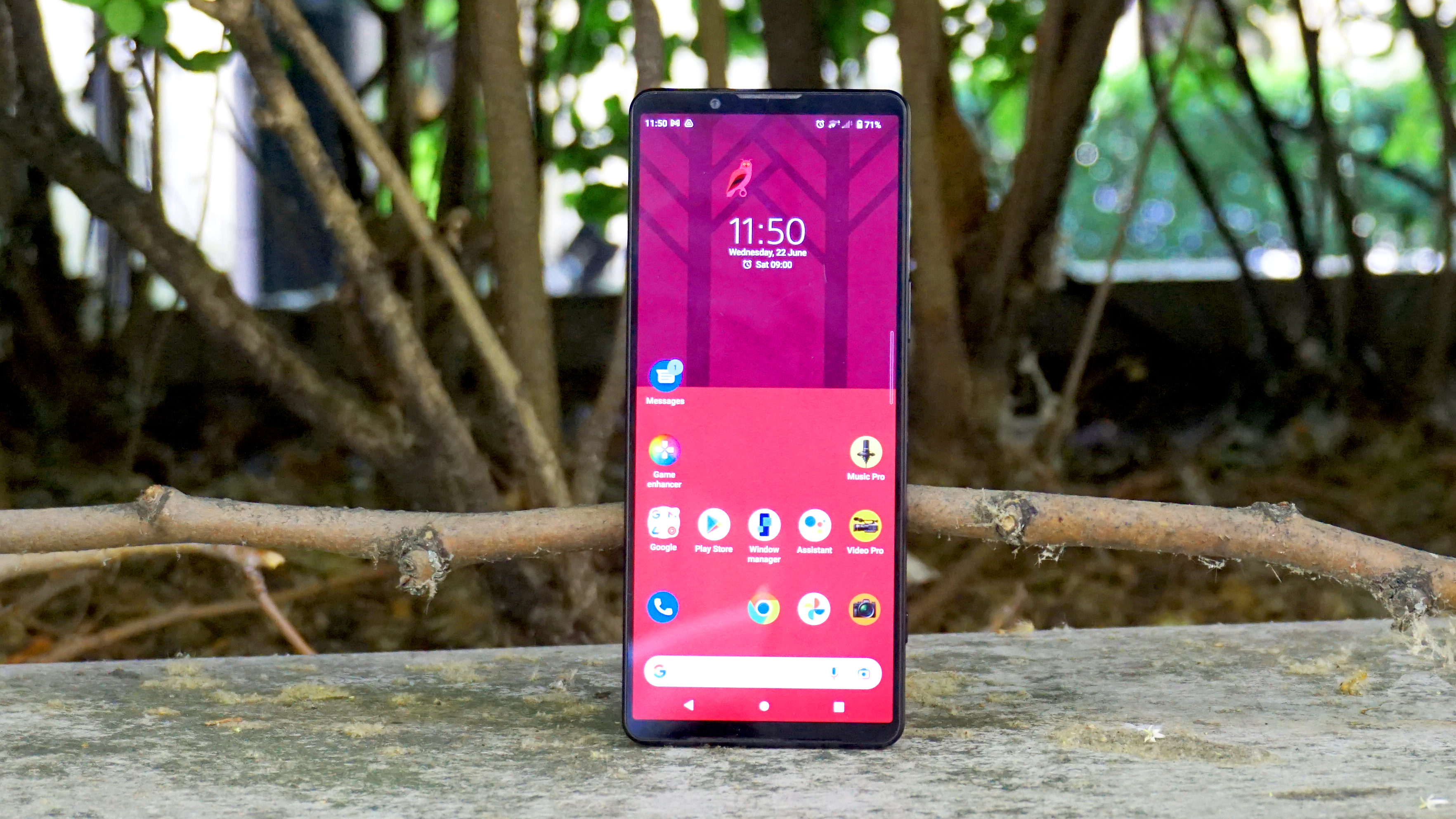 A Sony Xperia 1 IV from the front, outdoors with trees in the background