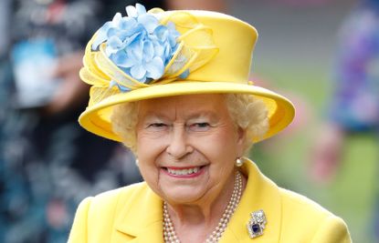 Queen Elizabeth II watches her horse 'Fabricate' run in the Wolferton Stakes