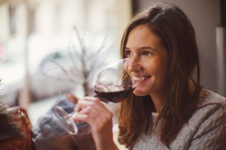 Woman drinking red wine from a glass