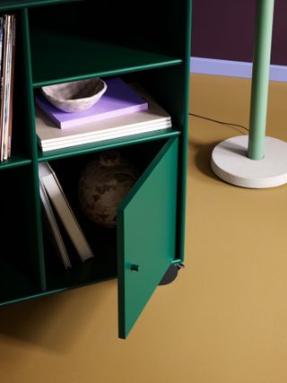 Green Montana Spin vinyl storage with open cabinet door