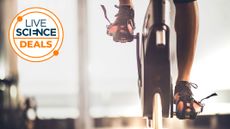 A Live Science deal logo and a close-up picture of a man in cycling shoes on an exercise bike