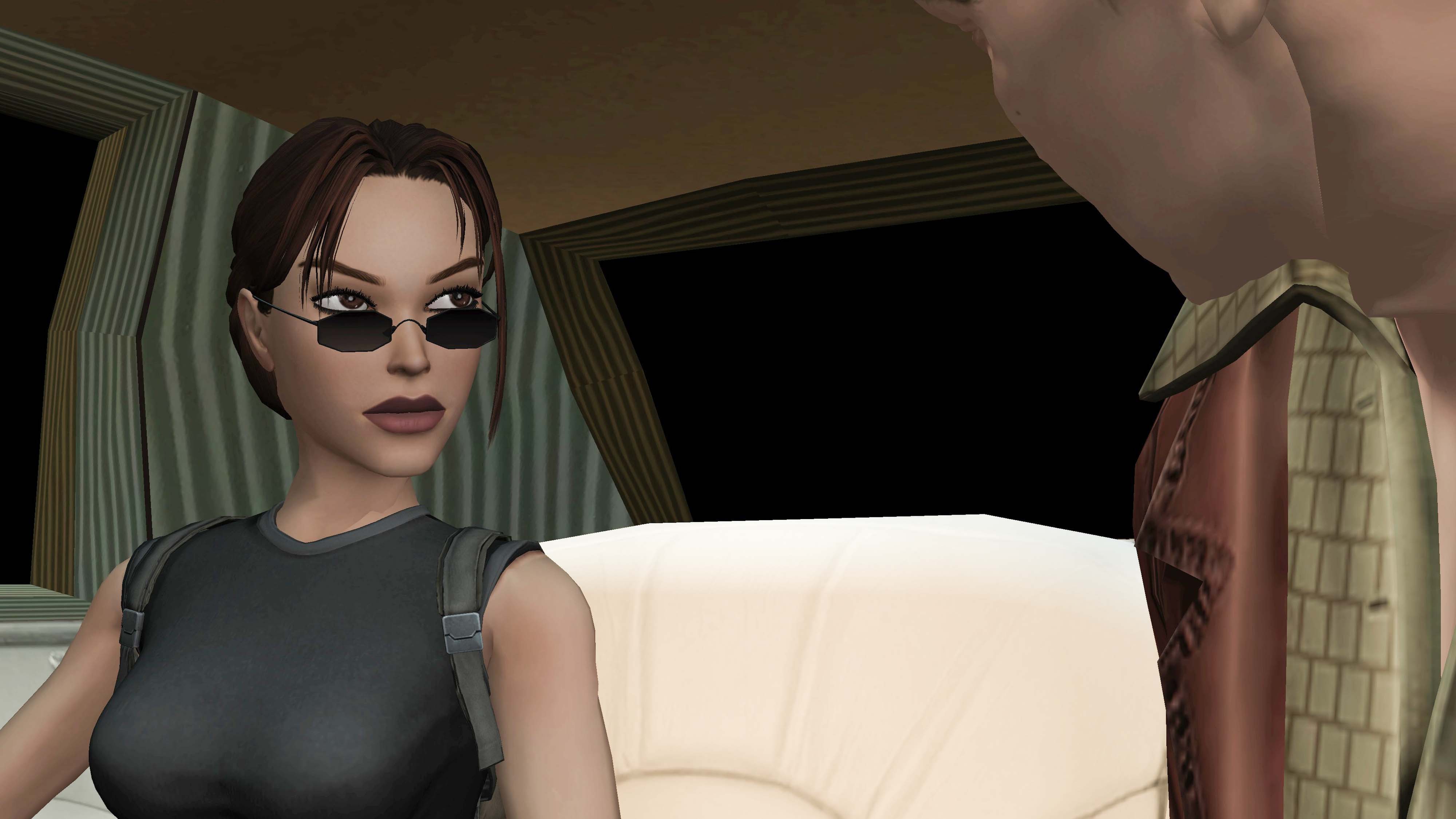 A screenshot from Tomb Raider: The Angle of Darkness showing Lara in a car talking to a man.