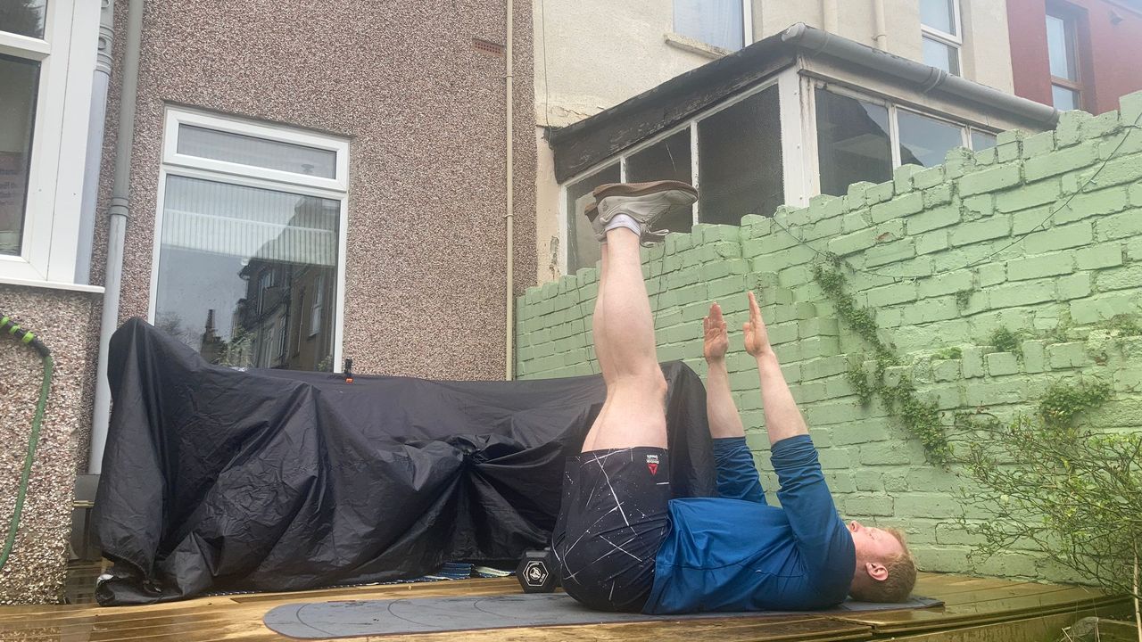 Fit&amp;Well fitness writer Harry Bullmore demonstrating a toe touch