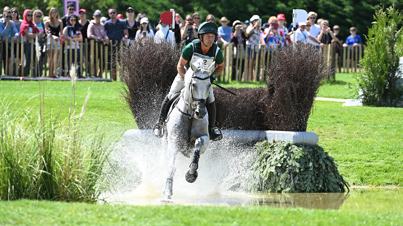 Burghley Horse Trials riders include Austin O&amp;rsquo;Connor, pictured cantering Colorado Blue through the water after jumping a brush fence at the Paris Olympics.