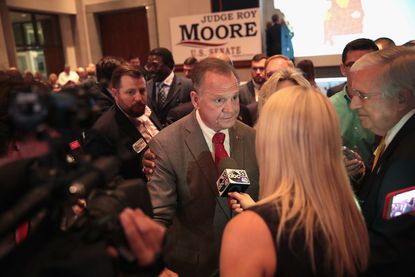 Roy Moore talks to reporters