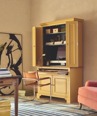 yellow free standing cabinet with desk inside