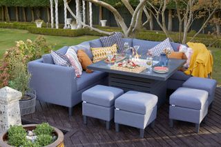 corner sofa with fire pit on decking from moda furnishings