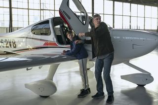 teddy sears as warren looking at a mini plane in a still from the night agent season 2