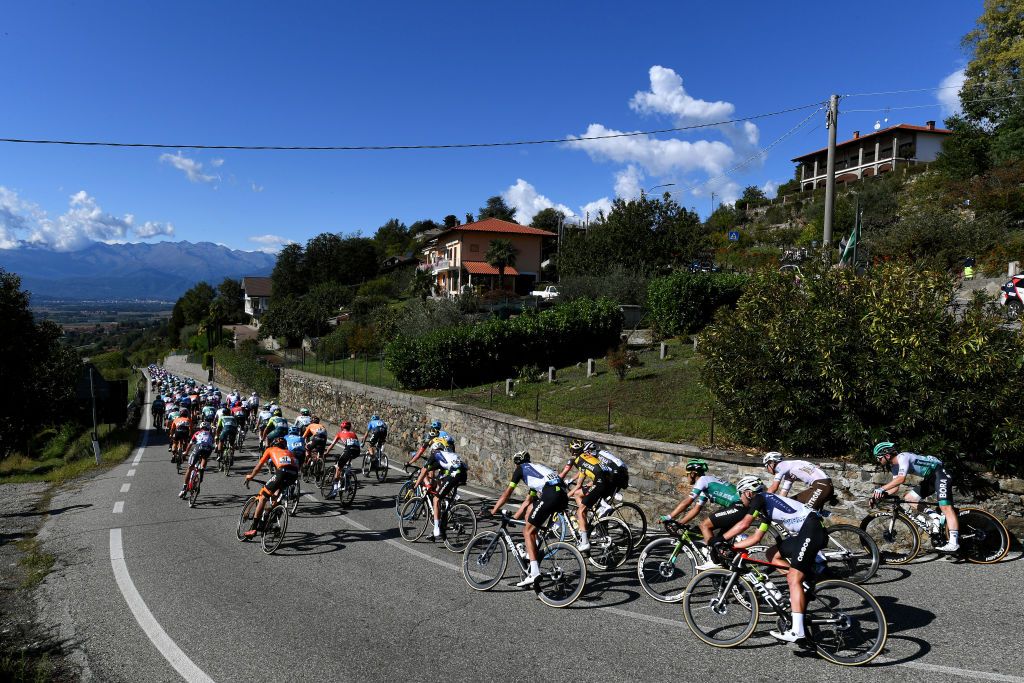 MILAN ITALY OCTOBER 06 A general view of the peloton pass through Piverone 242m during the 102nd MilanoTorino 2021 a 190km race from Magenta to Torino Superga 669m MilanoTorino on October 06 2021 in Milan Italy Photo by Tim de WaeleGetty Images