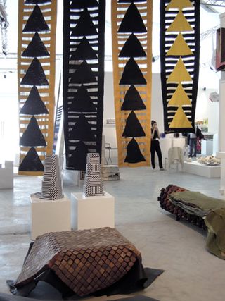 Black and Tan and yellow hanging rugs by BAZ Killim