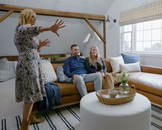 Shea McGee and clients in a living space with striped rug