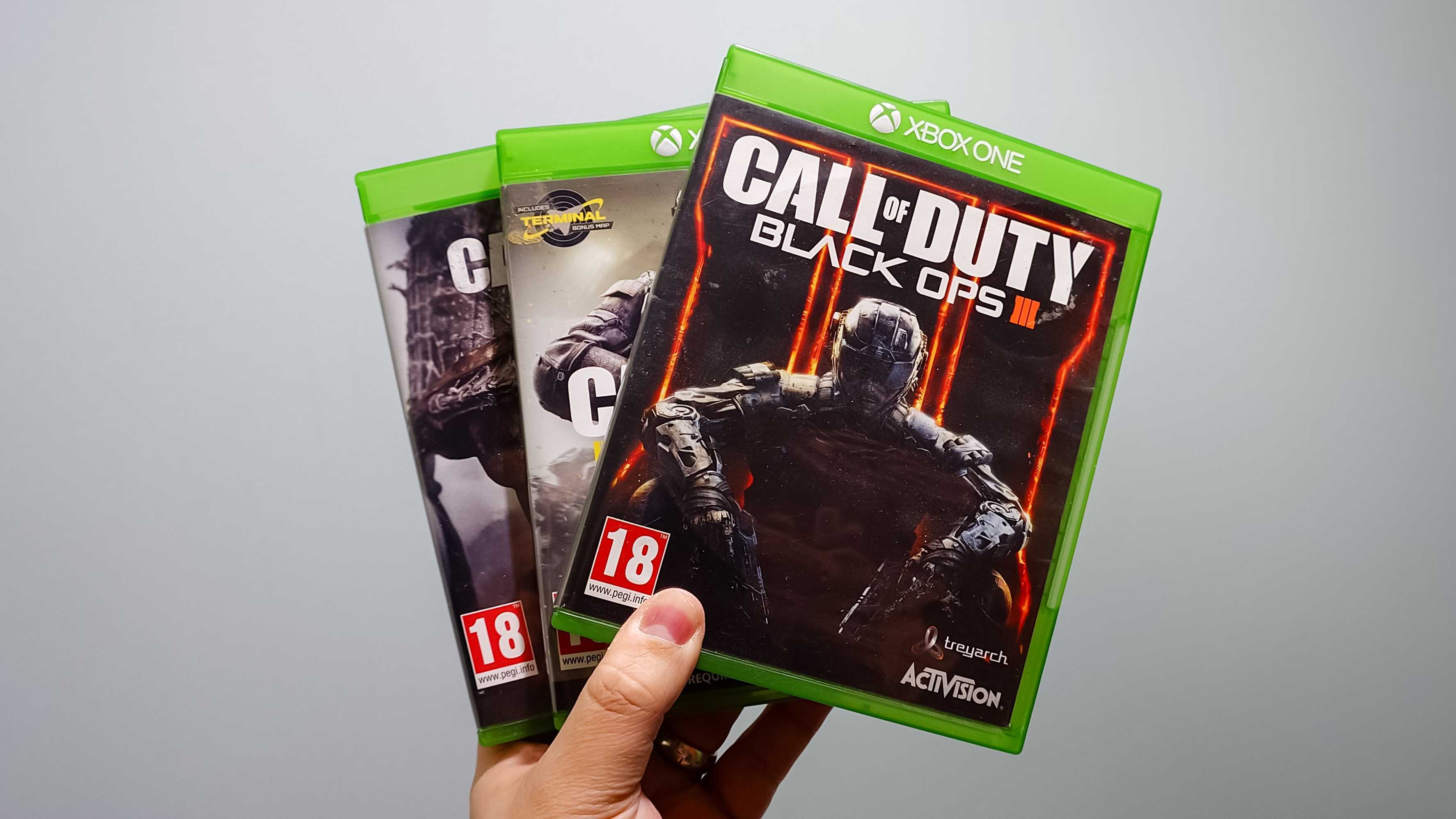 Call of Duty Black Ops 3, Infinite Warfare, and WWII game cases for the Xbox One. 