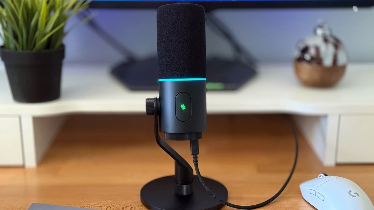 Razer Seiren V3 Pro microphone on wooden desk