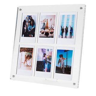 A clear acrylic Polaroid photo frame