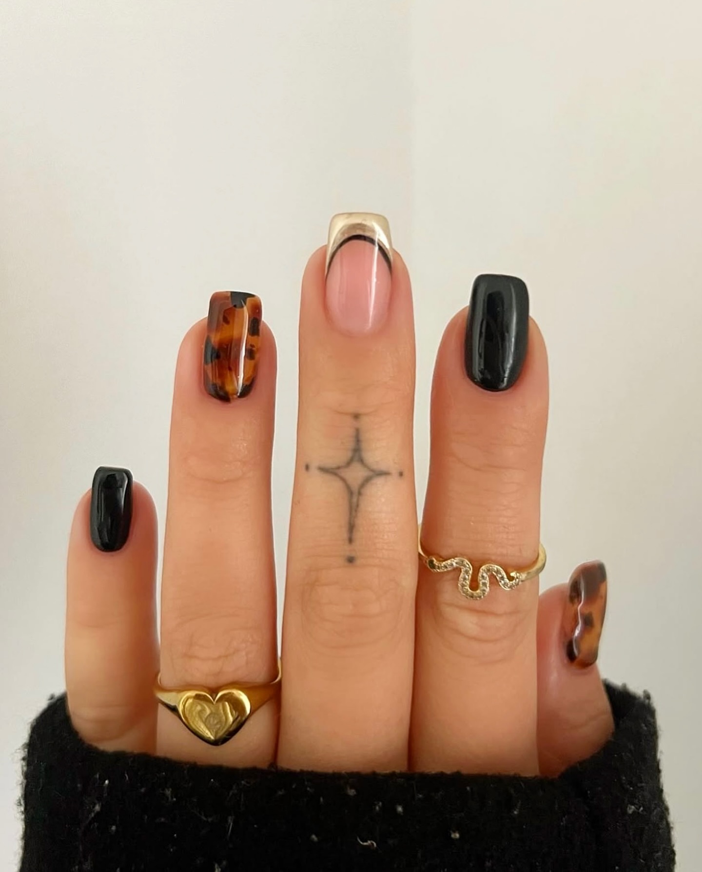 Black nail polish manicure design.