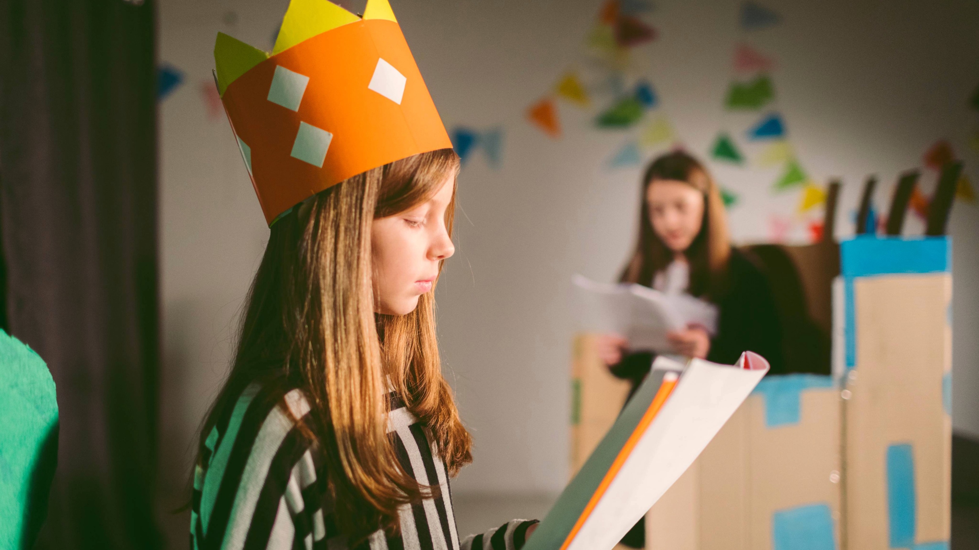 Young girl reading the script for a play