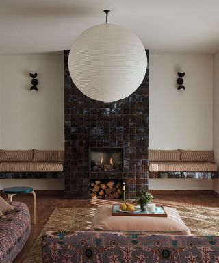 living room with tiled fireplace surround