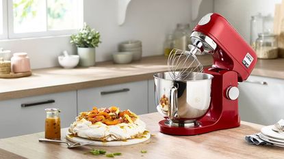 Kenwood kMix Stand Mixer on a countertop with a meringue in front of it