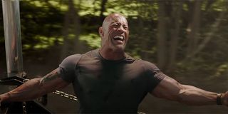 Hobbs holding on to a helicopter in Hobbs and Shaw