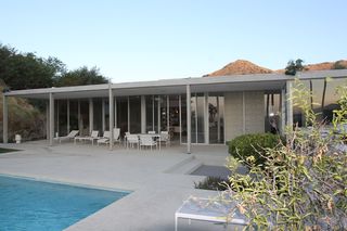 Poolside view of house and seating