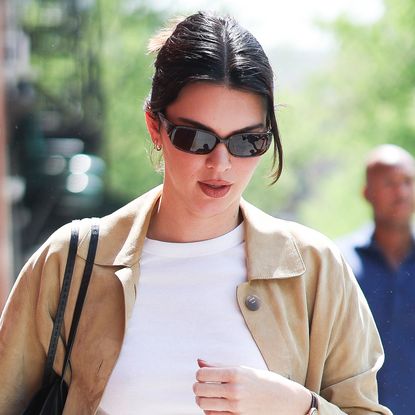 Kendall Jenner wears a white T-shirt with a suede jacket in NYC.