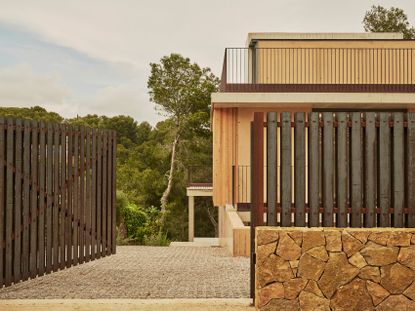 Spanish house Cala Tamarit, textured house among nature