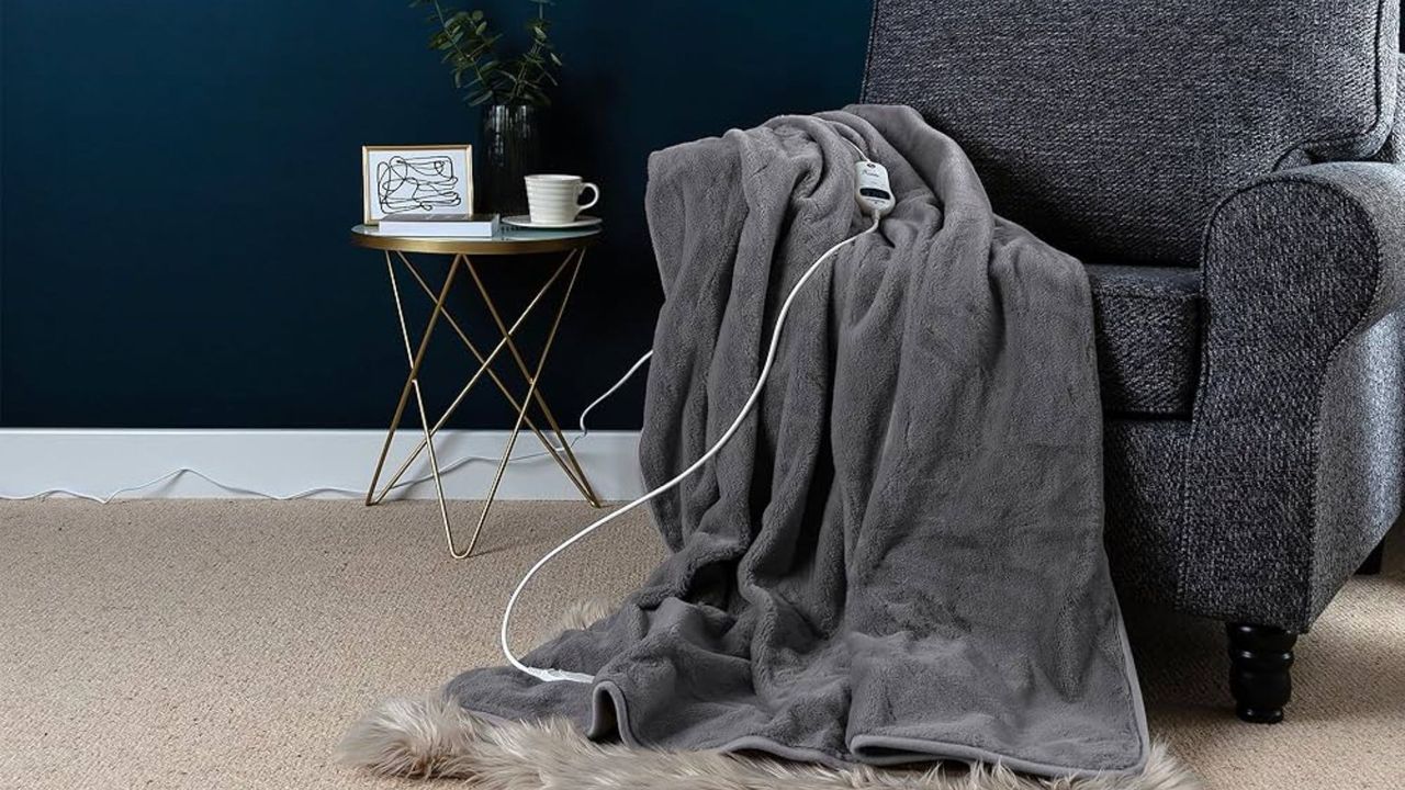 Slumberdown Cosy Hugs Heated Blanket draped over a chair